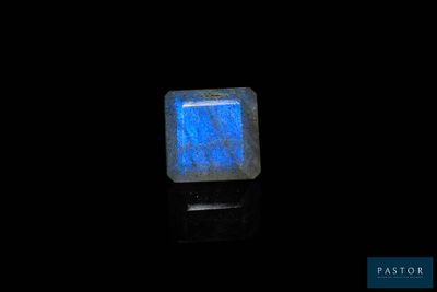 an image of a square blue stone with a black background