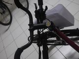 a close up of a bicycle handlebar with a box on it