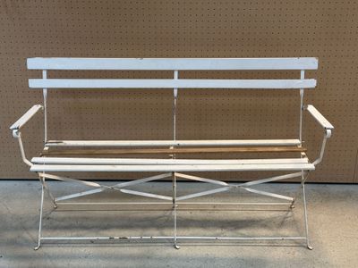 a white bench that is sitting in a room