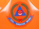an orange frisbee with a picture of a smiling face on it