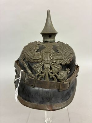 an old helmet with a bird on the top of it