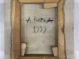 an old picture frame with a piece of fabric hanging from it ' s side