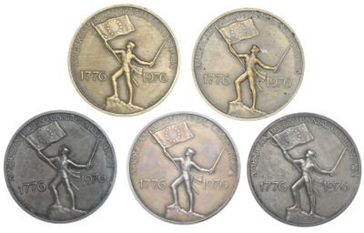 four different coins with a man holding a flag on them