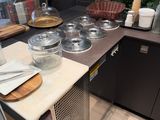 a counter that has a bunch of dishes on it