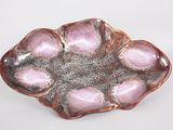 pink and silver flower shaped dish on a white background