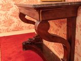 a table with a mirror on top of it in a room
