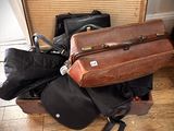 several pieces of luggage sitting on top of a hard wood floor