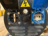 a close up of a blue and black electrical device