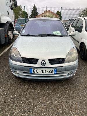 a silver car parked in a parking lot next to other cars