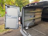 the back of a van with the door open and the back of the van with the door open