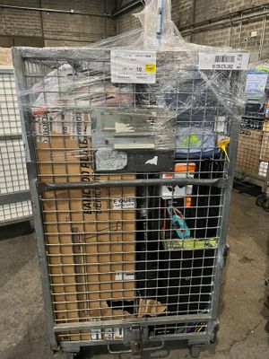a large metal cage with a bunch of boxes inside of it
