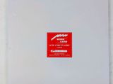 a white box with a red sticker on it
