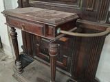 a wooden table with a mirror on top of it