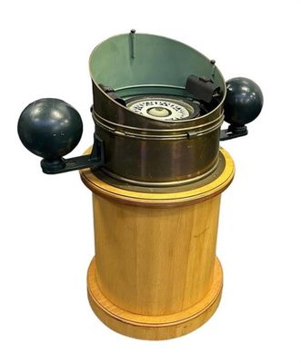 a wooden and metal device that is on a white background