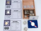 a box of coins and a medal on a table