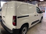 a white van that is parked in a garage