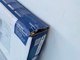 a box sitting on the floor next to a toilet