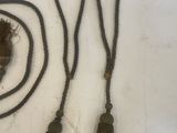 two pieces of rope and a pair of scissors on a table