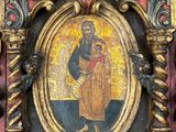 painting of the virgin mary and child jesus in a gilded frame