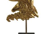 sculpture of a golden eagle head on a black marble base