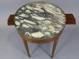 a marble top table with a drawer underneath it