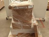 a stack of boxes sitting on top of a cart in a warehouse