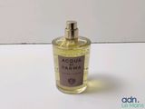 an image of a bottle of perfume sitting on a table