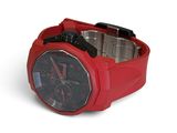 a red watch with a black face on a white background