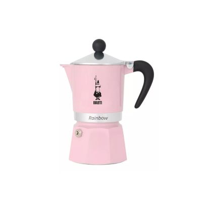 a pink stove top coffee maker sitting on top of a white table