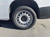 a white van that is parked in a parking lot
