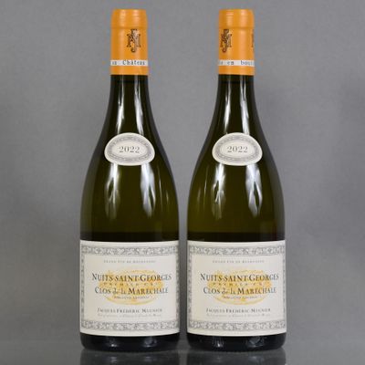 two bottles of wine sitting next to each other on a table