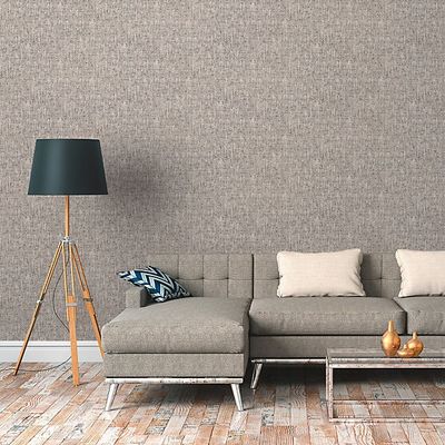 a couch and a lamp in a room with wood flooring