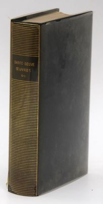 an old book sitting on top of a table next to a white background