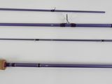 four different types of fishing rods are lined up on a white surface