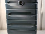 a blue suitcase sitting on top of a white table