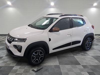 the white car is parked on a checkered floor in a garage