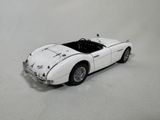 a toy car that is sitting on a white surface