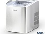 an image of a small ice maker sitting on top of a counter