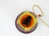a cup of tea and a wooden spoon on a table