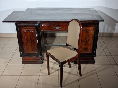 a chair sitting in front of a desk in a room