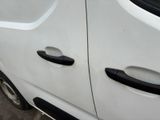 a white van that has a black handle on it