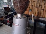 a coffee grinder sitting on a counter in a kitchen