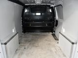 a white van that is parked inside of a building