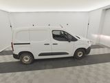 the white van is parked in a clean room with a checkered floor