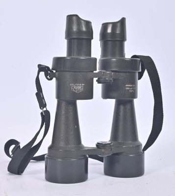 a pair of binoculars sitting on a white surface
