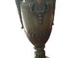 a vase that is sitting on a stand on a white background