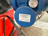 an image of a close up of a blue valve on a machine