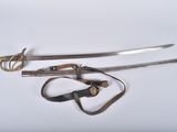 two swords and a pair of scissors on a white surface
