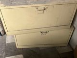 a picture of a chest of drawers in the corner of a room
