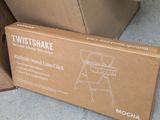 a cardboard box with a picture of a baby ' s highchair in it